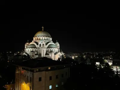 a domed building with a cross on top at night at Vintage Delight Apartment Vracar Hram Sv Save in Belgrade
