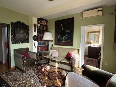 a living room with a couch and chairs and a table at Vintage Delight Apartment Vracar Hram Sv Save in Belgrade