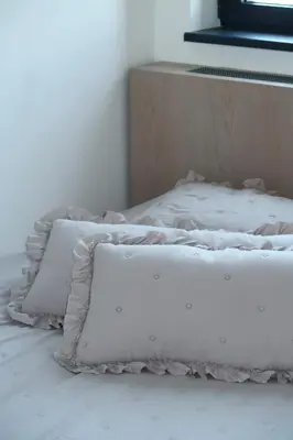 a bed with two pillows on top of it at Belgrade Waterfront- Libera in Belgrade