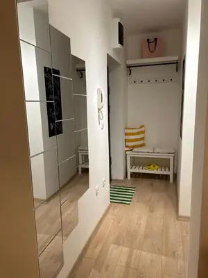 a hallway with a glass shower in a room at Apartment Fiore in Smederevo