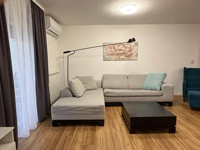 a living room with a couch and a coffee table at Deluxe apartment Magnolia 2 in Belgrade