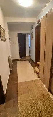 a living room with a hallway with a rug on the floor at Blossom in Belgrade