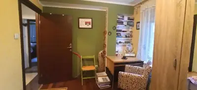 a room with a desk and a green wall at Blossom in Belgrade