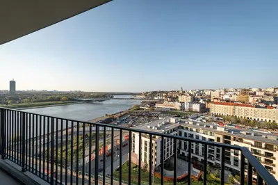 a view of a river from a balcony of a building at Sinfonia Lux 1205 in Sajmište