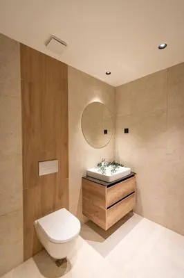 a bathroom with a toilet and a sink and a mirror at Sinfonia Lux 1205 in Sajmište