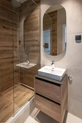 a bathroom with a sink and a shower at Sinfonia Lux 1205 in Sajmište