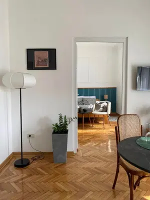 a living room with a table and a dining room at LUX Apartment in Belgrade, Centre in Belgrade