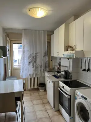a kitchen with a stove and a dishwasher in it at İstanbul apartment 2 in Belgrade