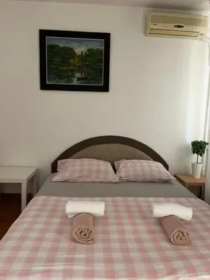 a bedroom with a bed with two towels on it at İstanbul apartment 2 in Belgrade