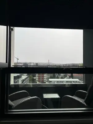 a view of a room with chairs and a window at Jana apartment in Belgrade