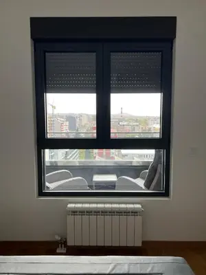 a window in a room with a radiator under it at Jana apartment in Belgrade