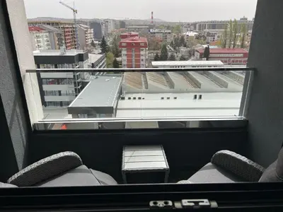 a room with a view of a city from a window at Jana apartment in Belgrade