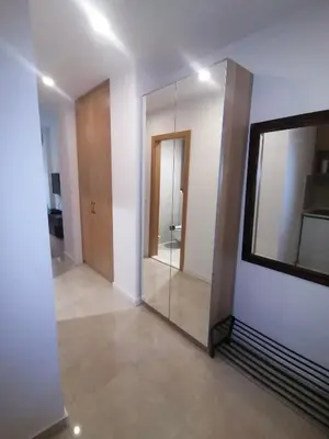 a large mirror in a room with a hallway at Skyline Studio Belgrade in Belgrade