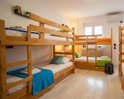 a room with three bunk beds in a house at BGD Downtown Hostel in Belgrade