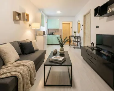 a living room with a couch and a table at BGD Downtown Hostel in Belgrade
