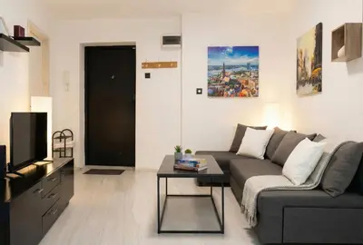 a living room with a couch and a table at BGD Downtown Hostel in Belgrade
