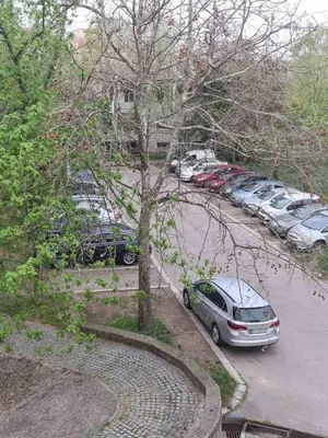 a group of cars parked in a parking lot at Runaway Hill in Bežanija