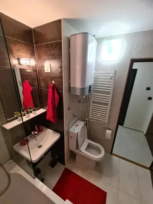 a small bathroom with a toilet and a sink at Runaway Hill in Bežanija