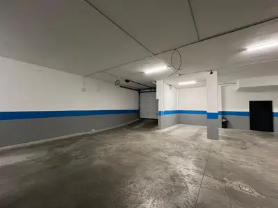 an empty room with blue and white stripes on the walls at Nobel West Hotel in Belgrade