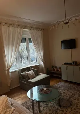 a living room with a couch and a table at DeeM-LUX in Belgrade