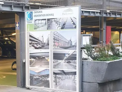 a building with a sign in the front of it at DeeM-LUX in Belgrade