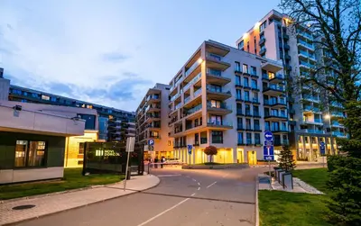 an empty street in a city with tall buildings at City Center - Colors Apartment with Garage in Belgrade