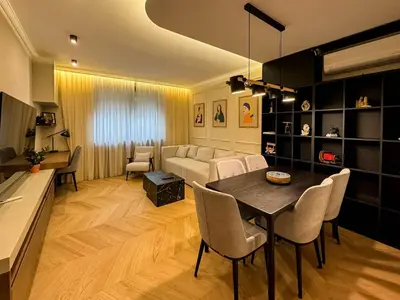 a living room with a table and a couch at Momentum in Belgrade