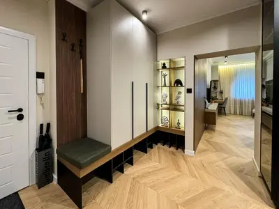 a hallway with a room with a bench and a mirror at Momentum in Belgrade