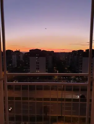 a view of a city skyline at sunset at 70 square meters in Block 61 in Bežanija