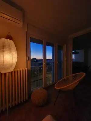 a living room with a large window with a view at 70 square meters in Block 61 in Bežanija