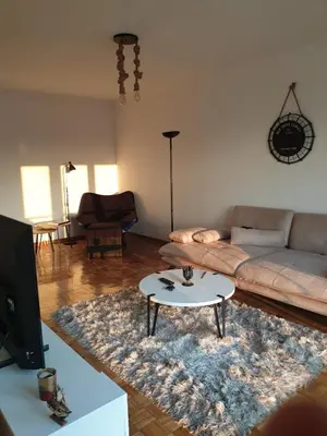 a living room with a couch and a table at 70 square meters in Block 61 in Bežanija