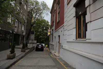 a car parked on the side of a street at Atelier 1 Apartment in Belgrade