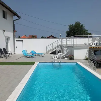 a swimming pool in front of a house at BigNest in Smederevo
