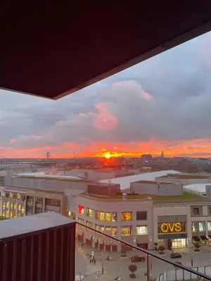 a sunset over a city with a cvs building at Best View Belgrade Waterfront in Belgrade