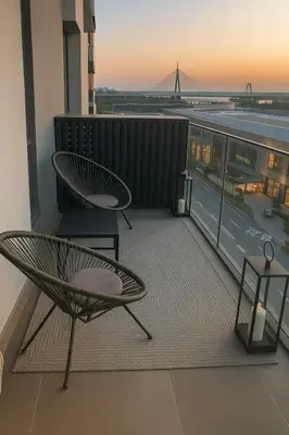 a balcony with a chair and a view of a bridge at Best View Belgrade Waterfront in Belgrade