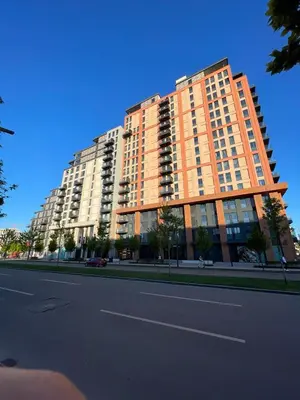 a large apartment building on the side of a street at Best View Belgrade Waterfront in Belgrade