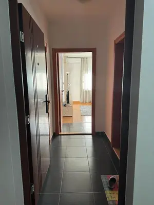 a hallway with a door leading to a room at Studio29 in Ruma