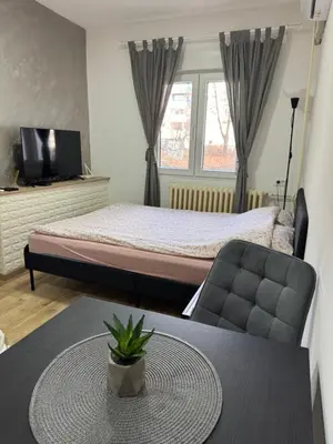 a hotel room with a bed and a table with a table sidx sidx at Sixty three in Novi Beograd