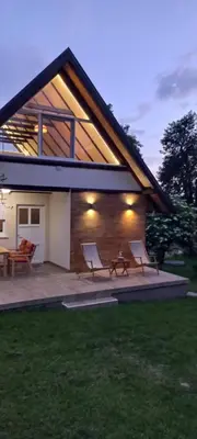 a house with two chairs and a patio at Vikendica Živković in Lazarevac