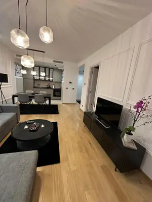 a living room with a couch and a table at LL65 Apartments Novi Dorcol in Belgrade