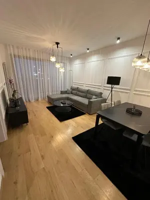 a living room with a couch and a table at LL65 Apartments Novi Dorcol in Belgrade