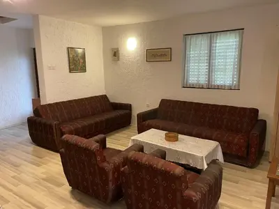 a living room with two couches and a table at Vila Plavinac in Smederevo