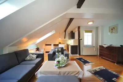 a living room with a couch and a table at Apartment Resavska in Belgrade