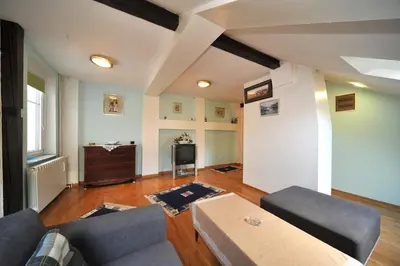 a living room with a couch and a table at Apartment Resavska in Belgrade