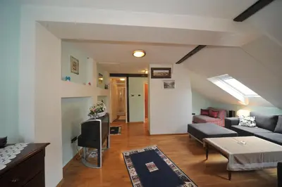 a living room with a couch and a tv at Apartment Resavska in Belgrade
