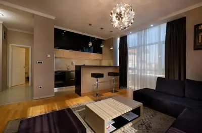a living room with a couch and a table at Apart K Apartments in Belgrade