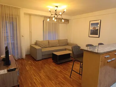 a living room with a couch and a table at TWINS in Belgrade