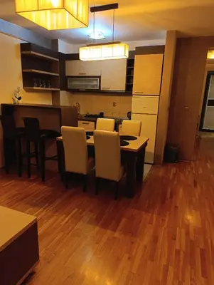 a kitchen and dining room with a table and chairs at TWINS in Belgrade