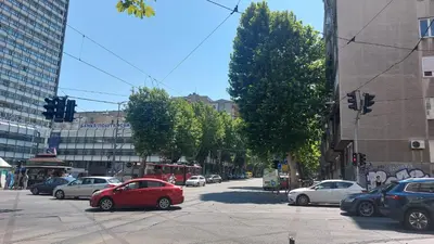 a busy city street with cars parked on the street at BMM LUX APARTMENT CENTAR in Belgrade