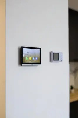 a refrigerator with a tv on top of it at Tesla Sky Apartment in Ledine
